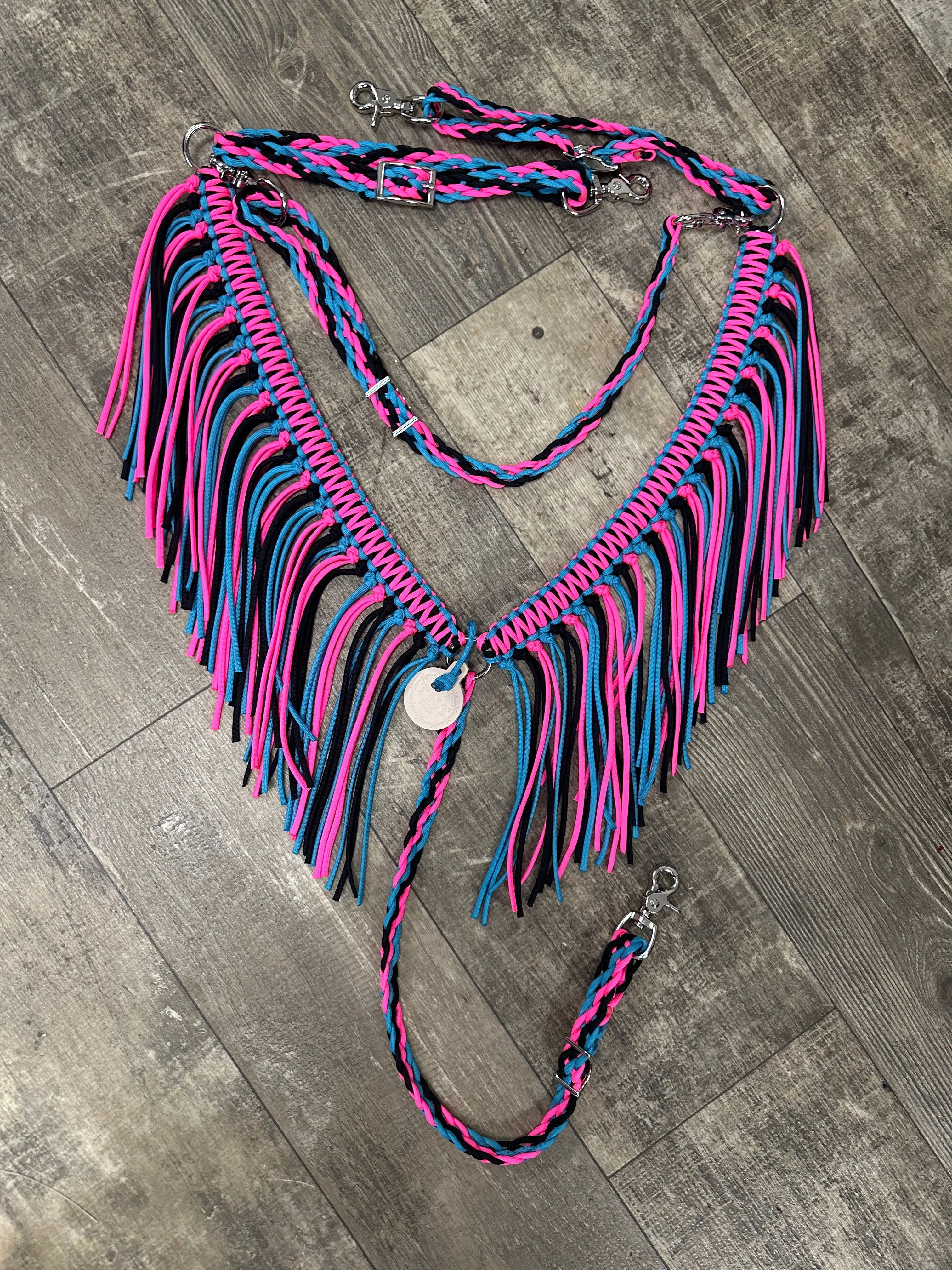 Hot pink, black, and turquoise fringe breast collar with a wither strap